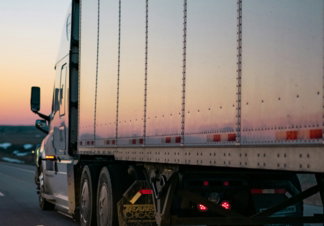 white-freight-truck-on-road-during-daytime.jpg white freight truck on road during daytime